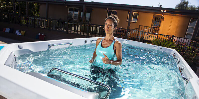 Woman jogging in an affordable swim spa