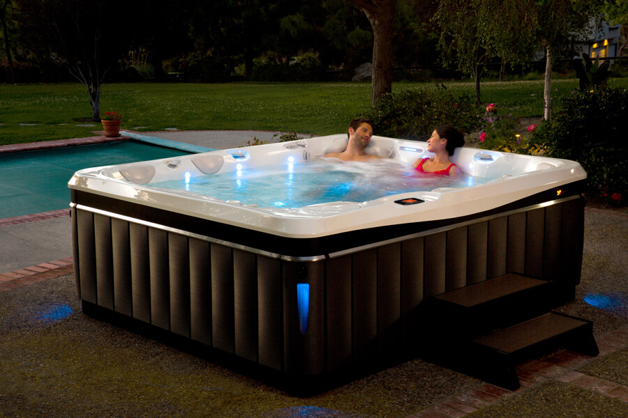 Couple relaxing in best Caldera salt water hot tub