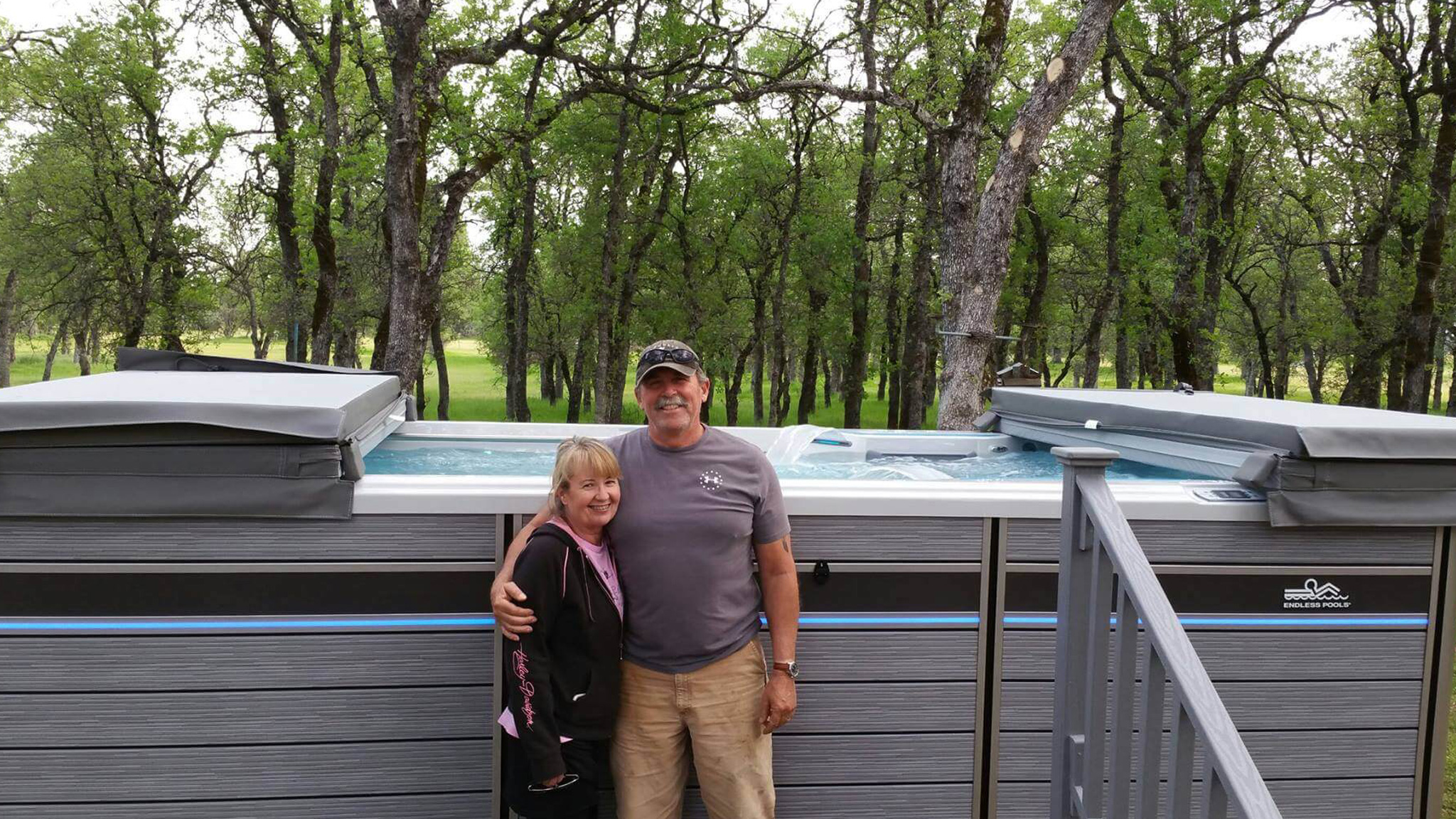Customers smiling with their hot tub delivery
